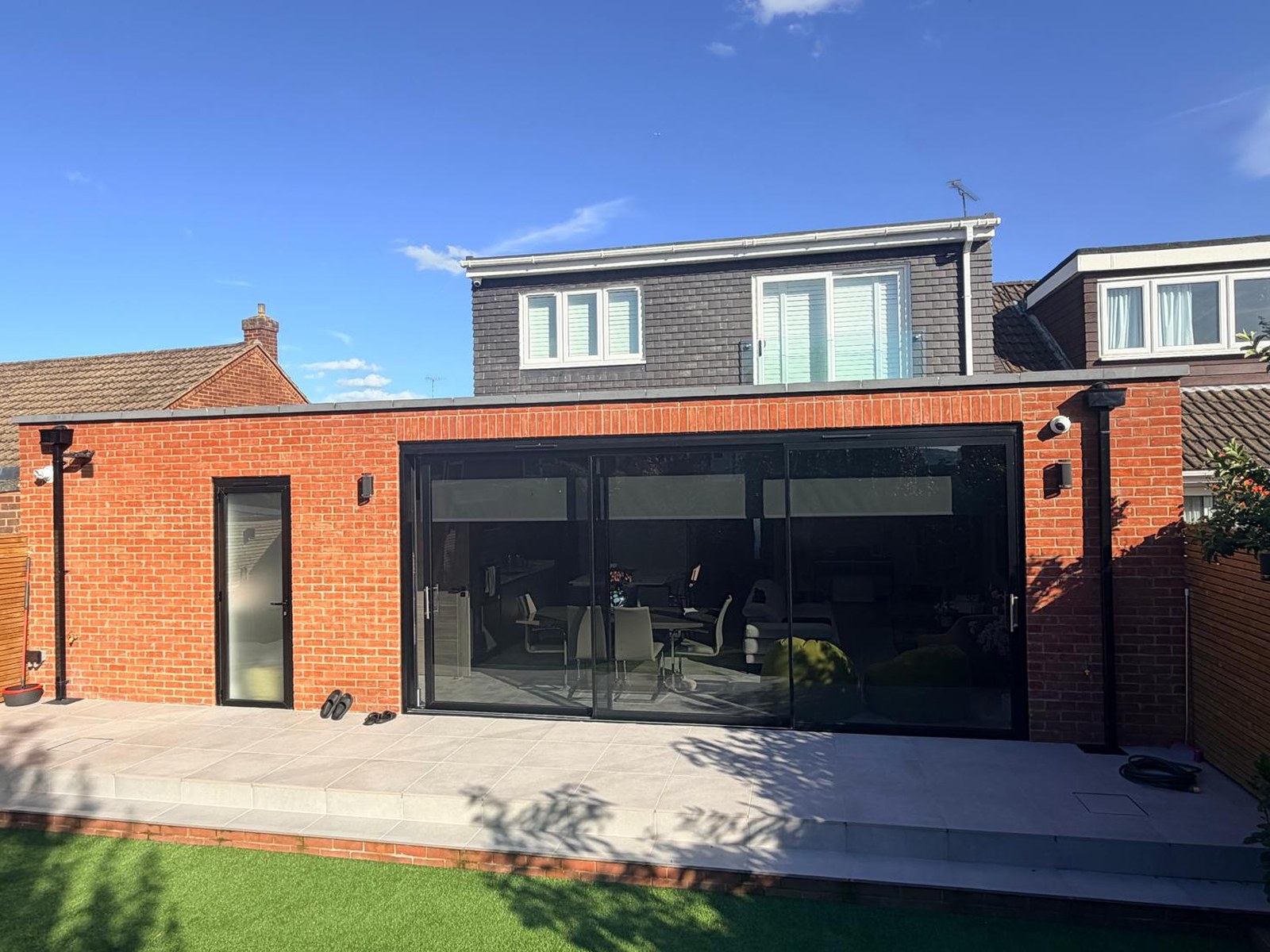 After: modern rear extension with loft dormer and bi-fold doors
