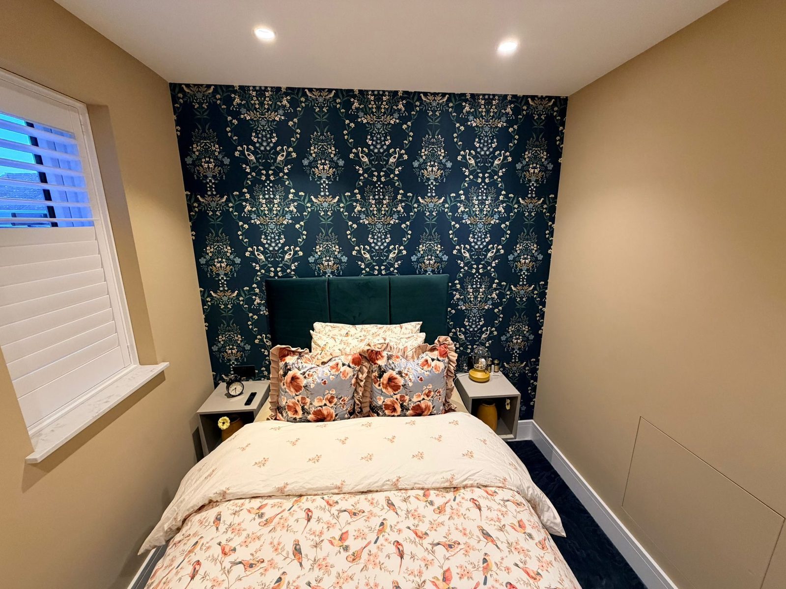 Bedroom with bold feature wallpaper